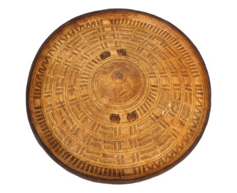 A Somali hide circular shield, turned ring and raised central boss, diameter 34cm 