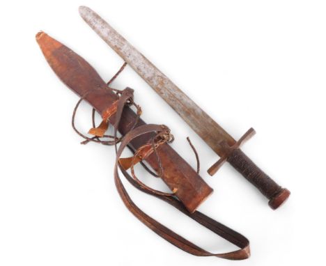 An Antique Sudanese kaskara sword and leather scabbard, with steel cross-guard with woven leather handle and engraved bird to