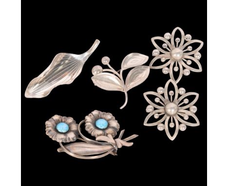 A group of 5 Danish silver floral design brooches, makers including John L, A&K, etc 