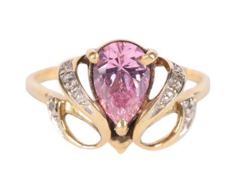 A fancy 14ct gold dress ring, set with a teardrop pink stone and scrolled diamond set shoulders, size R/S 