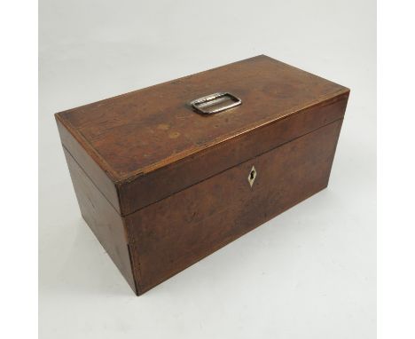 A late Georgian tea caddy, possibly in Yew wood, the rising lid opens to reveal two lidded compartments and a mixing bowl, wi