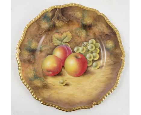 A Royal Worcester cabinet plate, hand painted with fruit to a mossy ground by J Smith, to a shaped gilt edge, diameter 10.5in