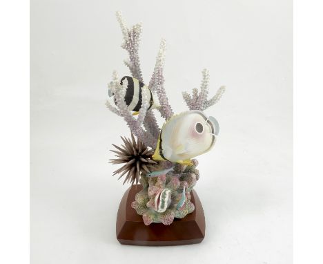 A Royal Worcester model, Four Eyed and Banded Butterfly Fish, designed and modelled by Ronald Van Ruyckevelt, marked Imperfec