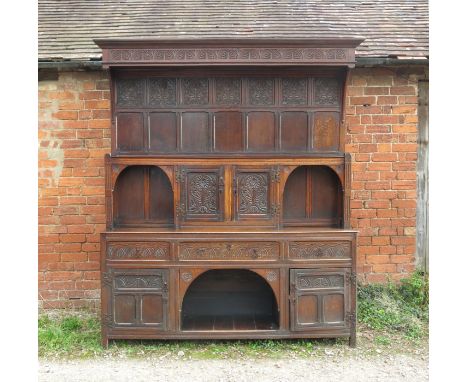 A 19th century oak dog kennel dresser, with associated panel back, with cupboards and shelf fitted drawers, and cupboard to t