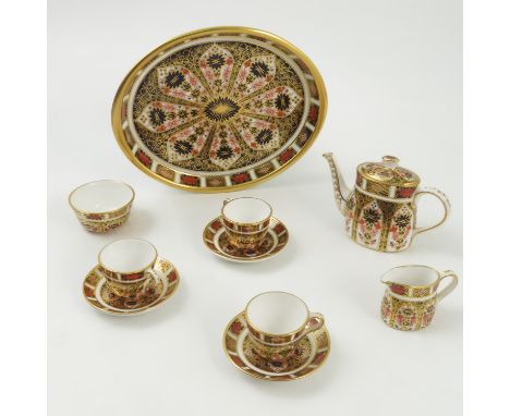 A Royal Crown Derby dolls cabaret set, comprising a tray, tea pot, milk jug and sugar bowl, together with three saucers and c