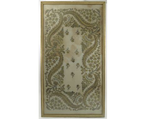 An embroidered panel, of scrolls and flowers, 19.5ins x 37ins