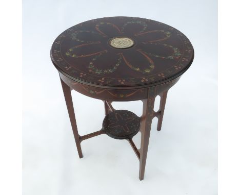 An Edwardian mahogany circular table, inlaid with a Wedgwood plaque, painted with floral decoration raised on four square tap