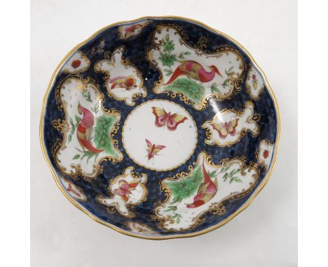 A Samson of Paris porcelain deep saucer, decorated with reserves of fabulous birds and insects, mock Worcester seal mark to b
