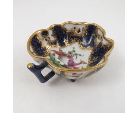 A Samson of Paris pickle dish, formed as a leaf, decorated with reserves of a fabulous bird and insects to a scale blue groun