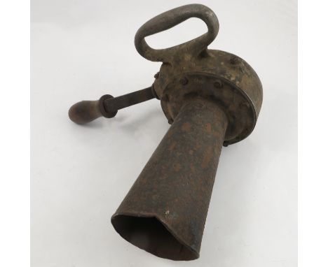 An army issue hand crank air raid siren, model 749, made in Chicago