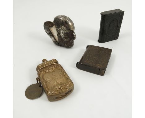 Four novelty vesta cases, a silver plated one formed as King Edward VII, a Bakelite case formed as a book with portrait of Qu