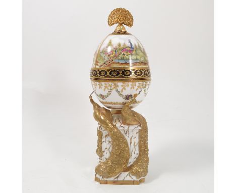 A Royal Worcester limited edition egg, Peacock Egg, modelled by Ken Potts, dated 1985, the peacock decorated cover lifting of