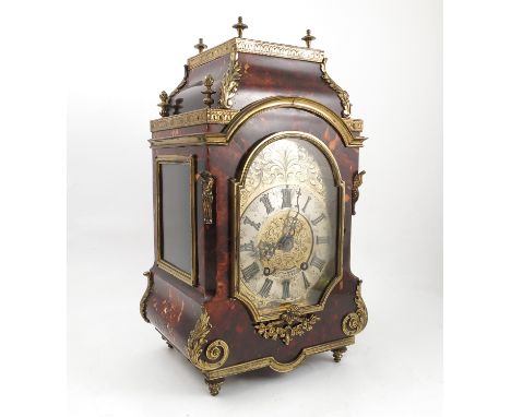 A tortoiseshell and gilt metal mounted mantel clock, the gilt engraved dial with silvered chapter ring and Roman numerals, th