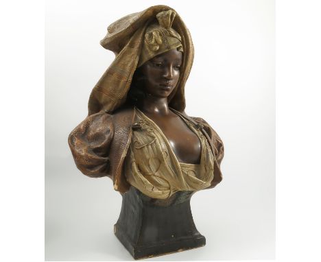 A Goldscheider polychrome bust, L'Orientale, originally after the artist Langer, of an African lady raised on a base marked 1