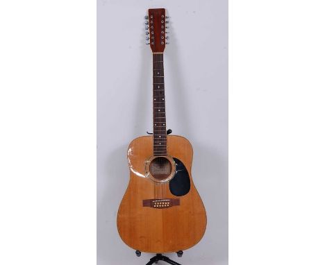 A Tanglewood model TW-1200 twelve string accoustic guitar.