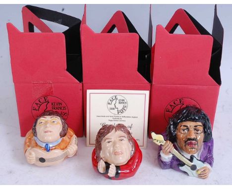A collection of three Kevin Francis hand painted ceramic face pots to include John Lennon, Mick Jagger and Jimi Hendrix, boxe