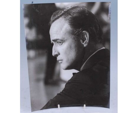 Marlon Brando, (1924-2004) American Actor and Academy Award winner, three 24 x 18.5cm black and white photographs, the first 