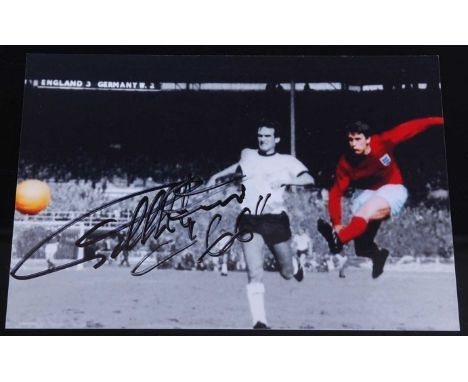 Sir Geoff Hurst, a 10 x 15cm photograph of Hurst scoring in the 1966 World Cup Final, signed in black ink, with Autografica c