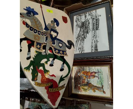 A painted shield shaped panel of a knight on horseback and dragon, 2 framed Victorians fashion etchings, 2 other framed pictu