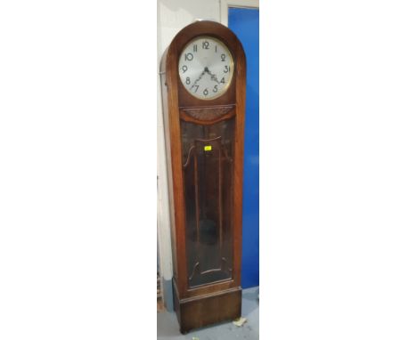 A 1930's longcase clock in oak arch top case, with chime 