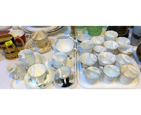 A collection of Victorian moustache cups 