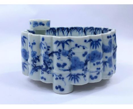 A Japanese blue and white lobed bamboo effect ceramic bowl with plant and traditional decoration, with small bowl above (poss
