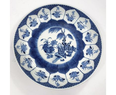 A Chinese blue and white ceramic dish with detailed traditional decoration with floral decoration to the exterior, diameter 2