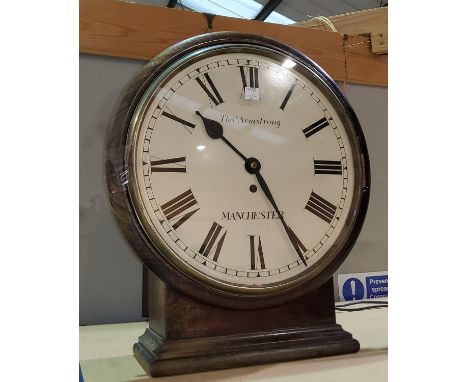 A wall/mantel clock in stained wood round case, single train fusee movement by Thos Armstrong Manchester, diameter 37cm. 