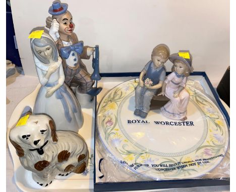 A Leonardo clown, boy and girl on bench and Lladro style woman; Staffordshire style small pot dog; a Royal Worcester cake pla