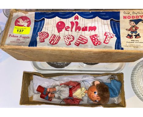 An originally boxed Pelham "Noddy" puppet.The puppet seems in good original condition, bell working, clothing colours looks a