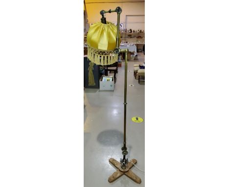 An early 20th century brass standard reading lamp,&nbsp;The X shaped base is obviously a later addition. The brass lamp colum