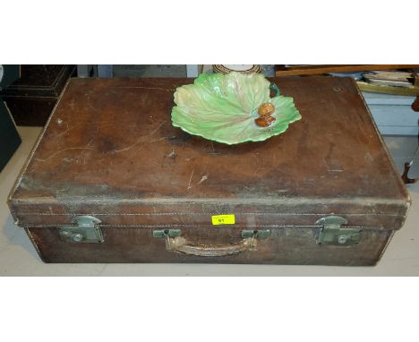 A mid 20th century leather suitcase with Carltonware nut bowl and a music stand 