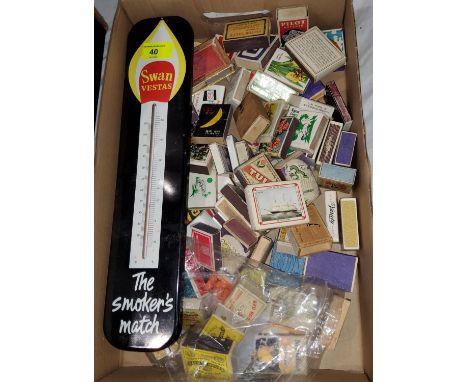A Swan Vesta advertising barometer; a selection of matchboxes; a bus sign 