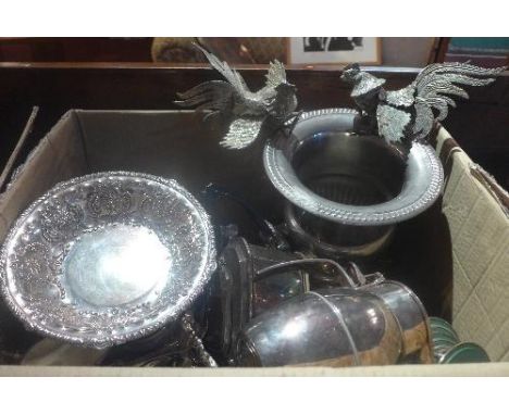 A large collection of silver plated items to include a wine cooler, pair of cockrails, napkin rings, coasters teapots, coffee