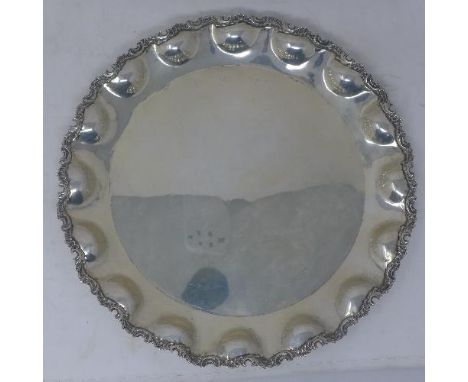 An Argentinian silver charger with scalloped border, stamped 900, 24oz 