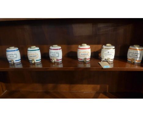A set of six Wade ceramic barrels 