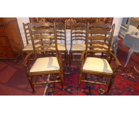 A set of six oak ladder back dining chairs to include two carvers 