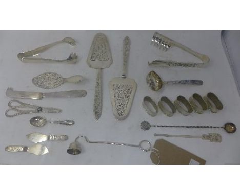 A collection of South American silver to include cake slices, napkin rings, asparagus tongs, scissors etc, 26oz 