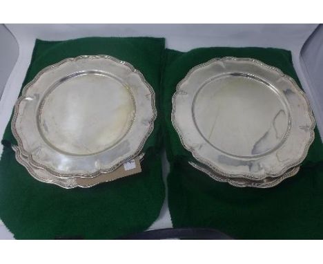 A set of twelve Mexican silver plates stamped 0.900, 165oz 