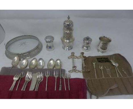 A collection of silver and silver plated ware, to include a pair of silver carving knife rests with floral decoration, hallma
