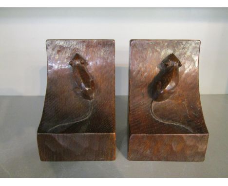 Robert Thompson of Kilburn - a pair of Mouseman oak bookends, each carved with a signature mouse and adzed decoration, 6 1/8"