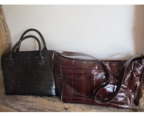 A black crocodile vintage style handbag, together with a brown eel skin shoulder bag 