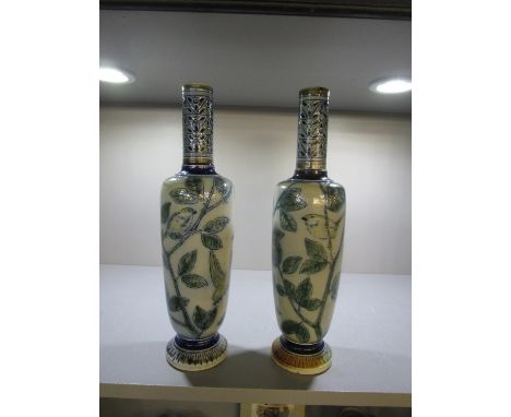 Robert Wallace Martin for Martin Brothers - a pair of stoneware vases of elongated shouldered form with narrow necks, raised 