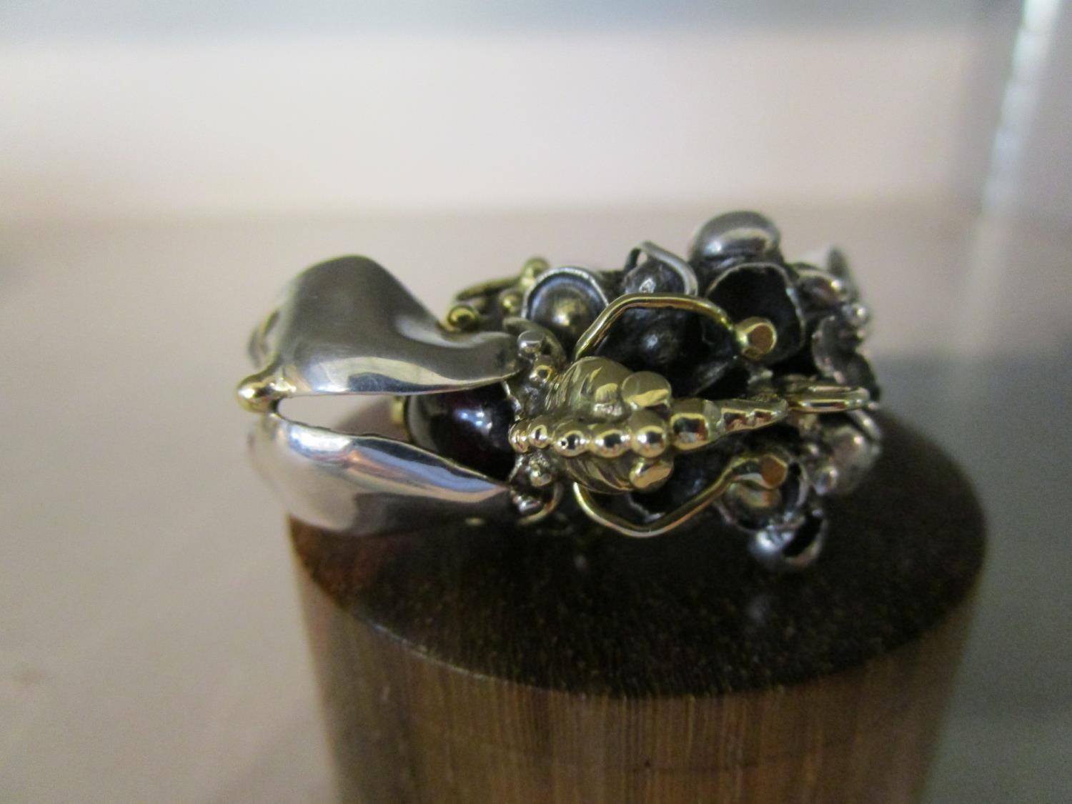 Michael Allen Bolton 1938-2006 - a cast silver ring with applied fly ...