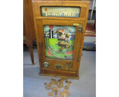 A mid 20th century oak cased, table top Each Way penny slot machine, together with a quantity of old pennies 