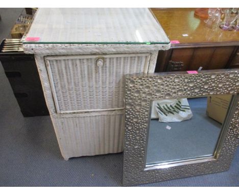 A vintage white painted front loading laundry basket in the Lloyd Loom style, together with a contemporary chrome wall mirror