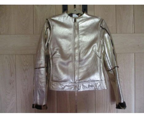 A Retro Versace Versus Pelle Cuir gold coloured leather jacket with a faux leopard print interior manufactured by Ittierre Sp