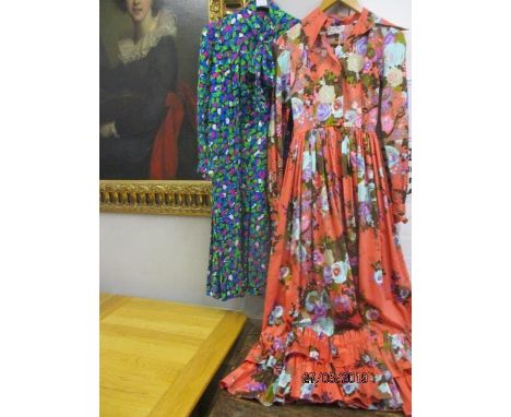 A vintage Nettie Vogues chintz evening dress with a coral coloured background and a turquoise and purple floral design, havin