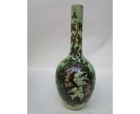 A Della Robbia pottery bottle vase with ovoid body decorated with two swallows, amongst acorns and oak leaves to both sides, 