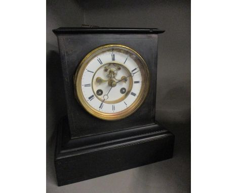 An early 20th century black slate mantle clock with key 